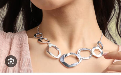 Silver Toned Twisted Necklace With Earrings